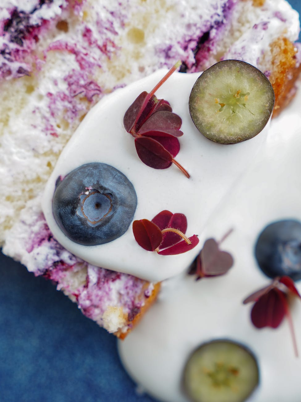 close up on yogurt with blueberries on cake slice